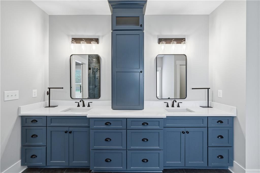 3584 Stock Road Monroe, GA 30656 - Photo 38 of 80 a bathroom with double vanity sinks and a mirror