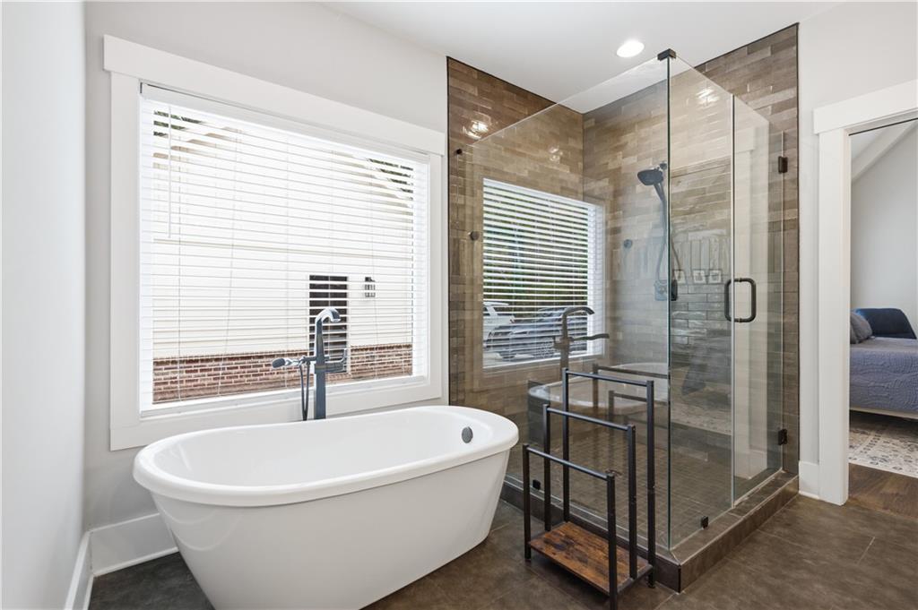 3584 Stock Road Monroe, GA 30656 - Photo 39 of 80 a white bath tub sitting next to a shower
