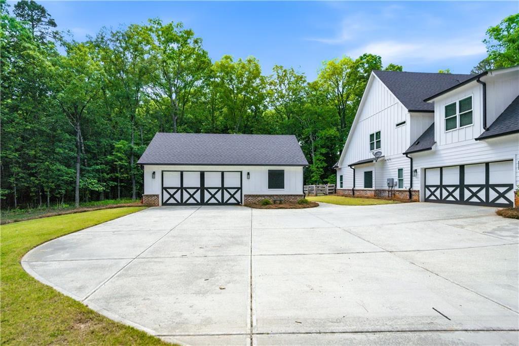 3584 Stock Road Monroe, GA 30656 - Photo 4 of 80 a view of a house with pool and a yard