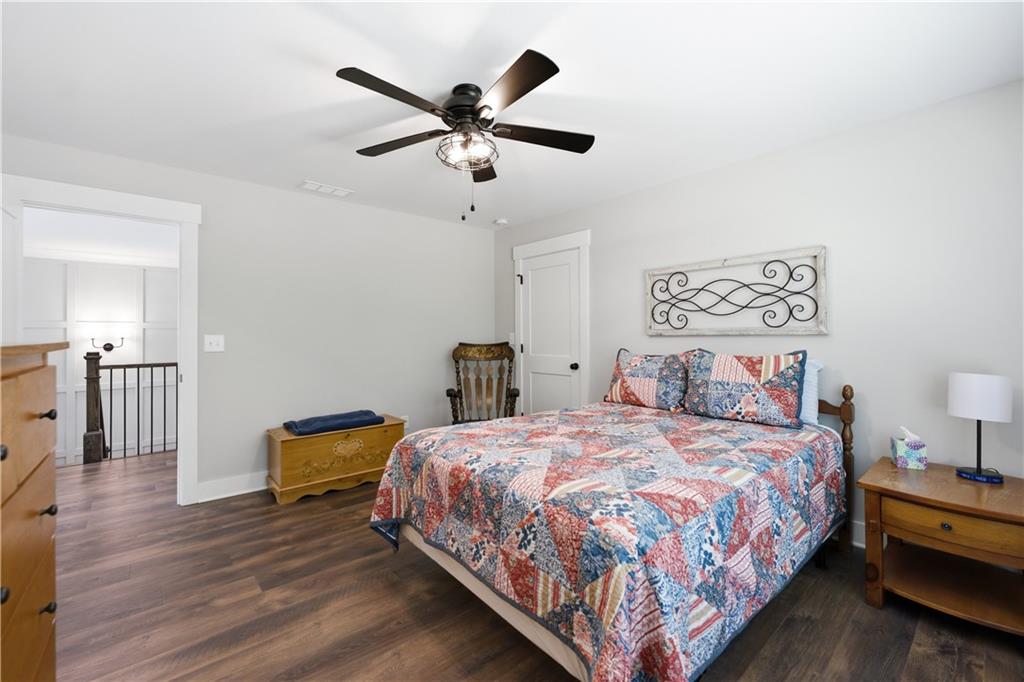 3584 Stock Road Monroe, GA 30656 - Photo 44 of 80 a bedroom with a bed and a chandelier