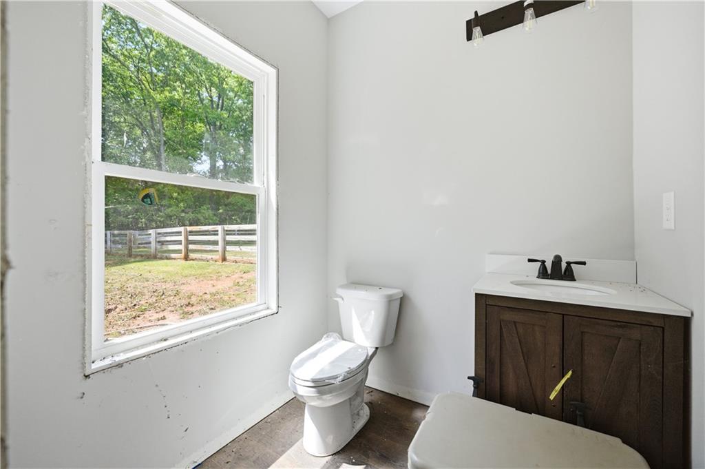 3584 Stock Road Monroe, GA 30656 - Photo 55 of 80 a bathroom with a toilet a sink and a window