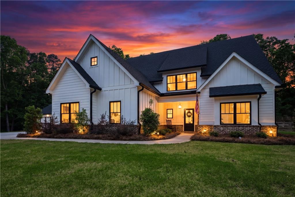 3584 Stock Road Monroe, GA 30656 - Photo 6 of 80 a front view of a house with a yard