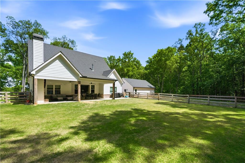 3584 Stock Road Monroe, GA 30656 - Photo 62 of 80 a front view of a house with a yard and trees