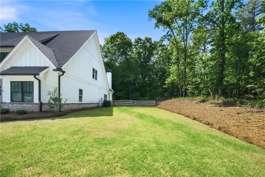 3584 Stock Road Monroe, GA 30656 - Photo 63 of 80 a view of a house with a yard and garage