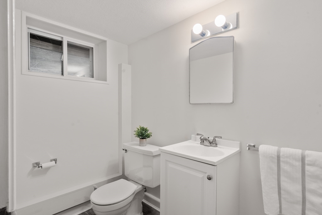 83 Bound Brook Road Newton, MA 02461 - Photo 18 of 21 a bathroom with a sink toilet and vanity