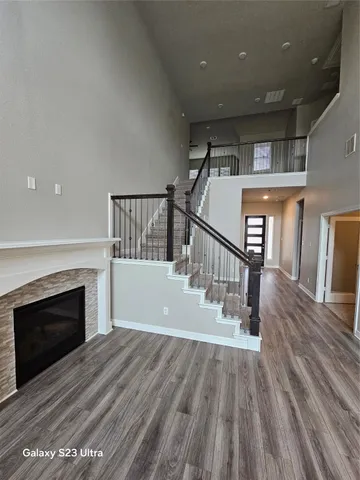 a view of a room with wooden floor