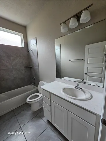 a view of a utility room with wooden floor
