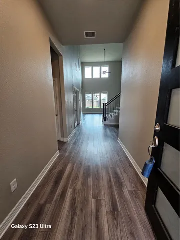 a view of gallery with wooden floor