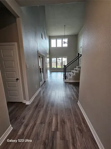 a view of gallery with wooden floor