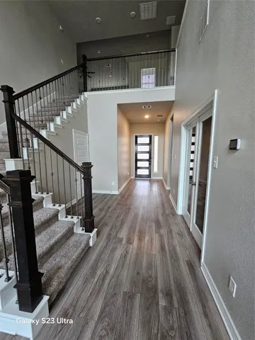 a view of entryway with wooden floor