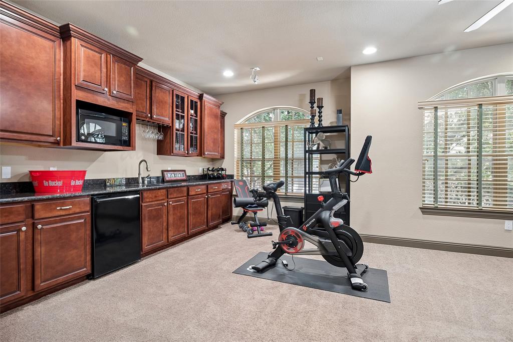 835 Rockingham Drive Irving, TX 75063 - Photo 20 of 27 a view of a kitchen with kitchen island granite countertop a stove a sink a dining table and chairs