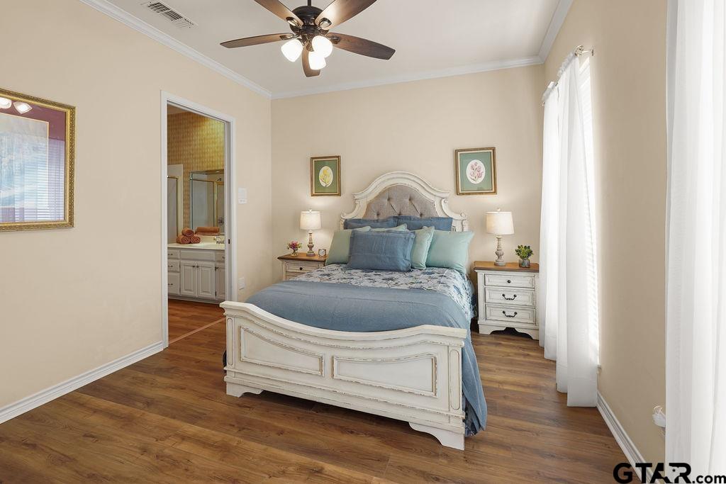 2210 Homestead Lane Tyler, TX 75701 - Photo 16 of 26 a living room with a bed furniture and a window