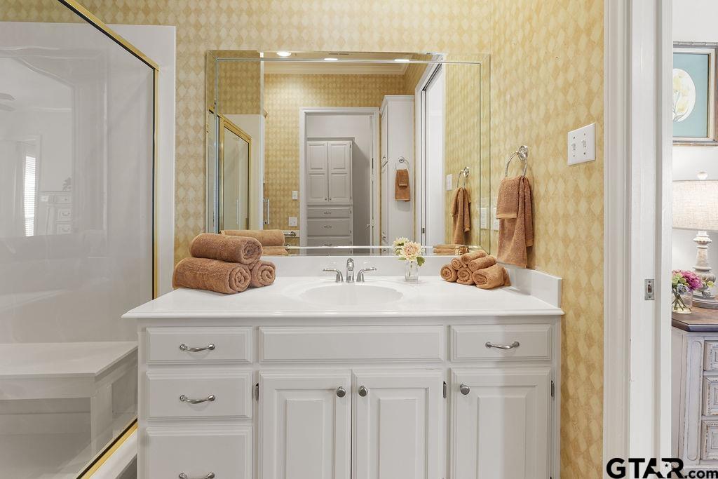 2210 Homestead Lane Tyler, TX 75701 - Photo 18 of 26 a bathroom with a sink vanity and a mirror