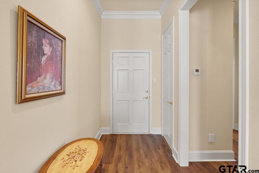 2210 Homestead Lane Tyler, TX 75701 - Photo 4 of 26 a view of a hallway with wooden floor