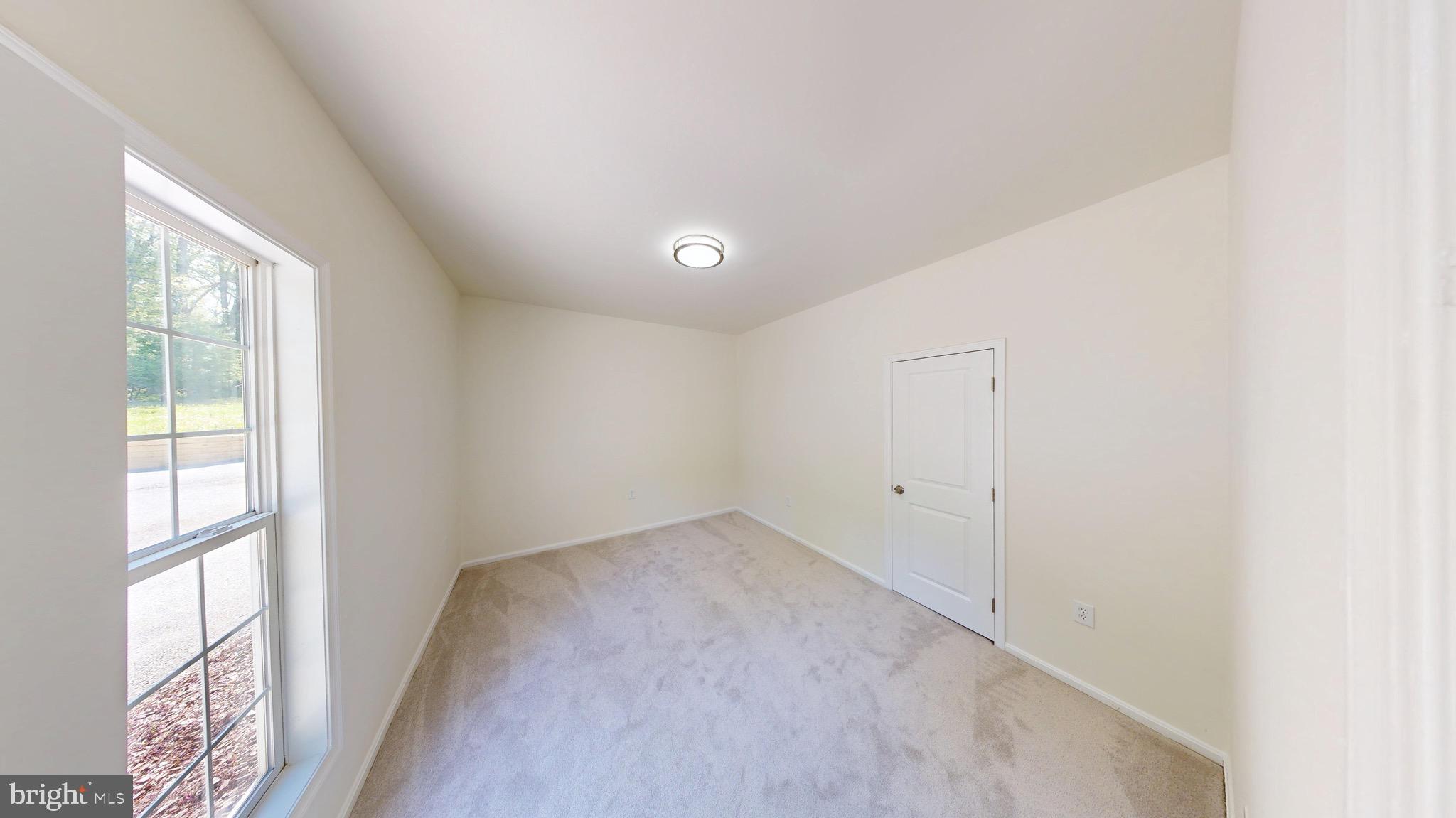 729 West Watersville Road Mount Airy, MD 21771 - Photo 10 of 42 a view of an empty room with a window