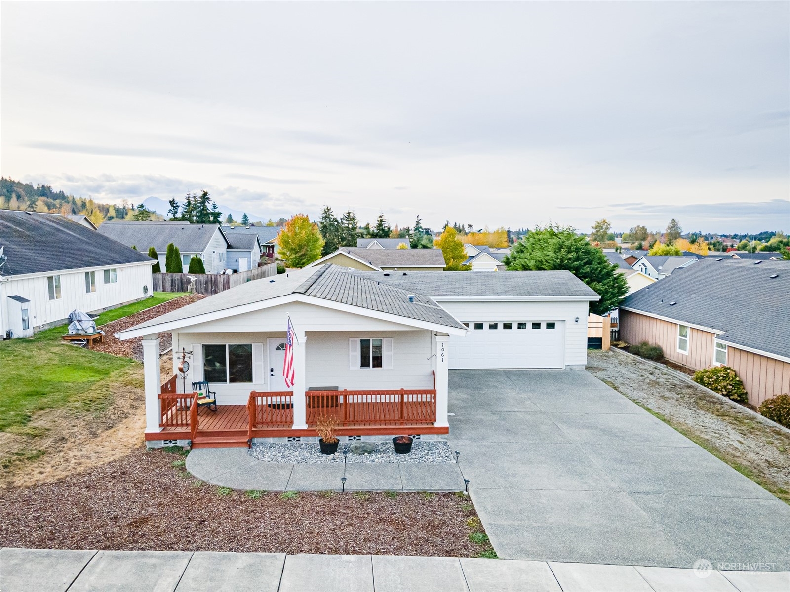 1061 Elk Loop Sequim, WA 98382 - Photo 5 of 26 aerial view of a house with porch and furniture