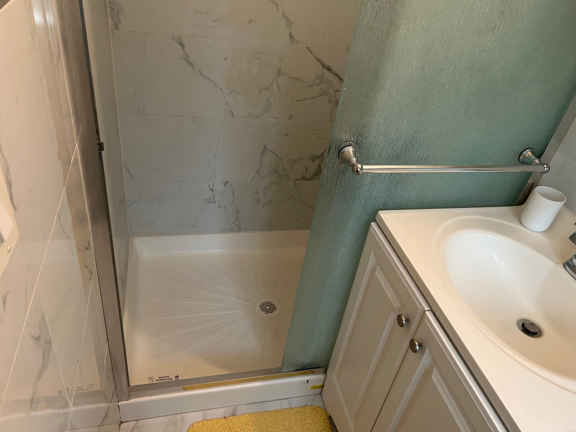 2 Secora Road, Unit C20 Monsey, NY 10952 - Photo 26 of 34 a bathroom with a sink and shower