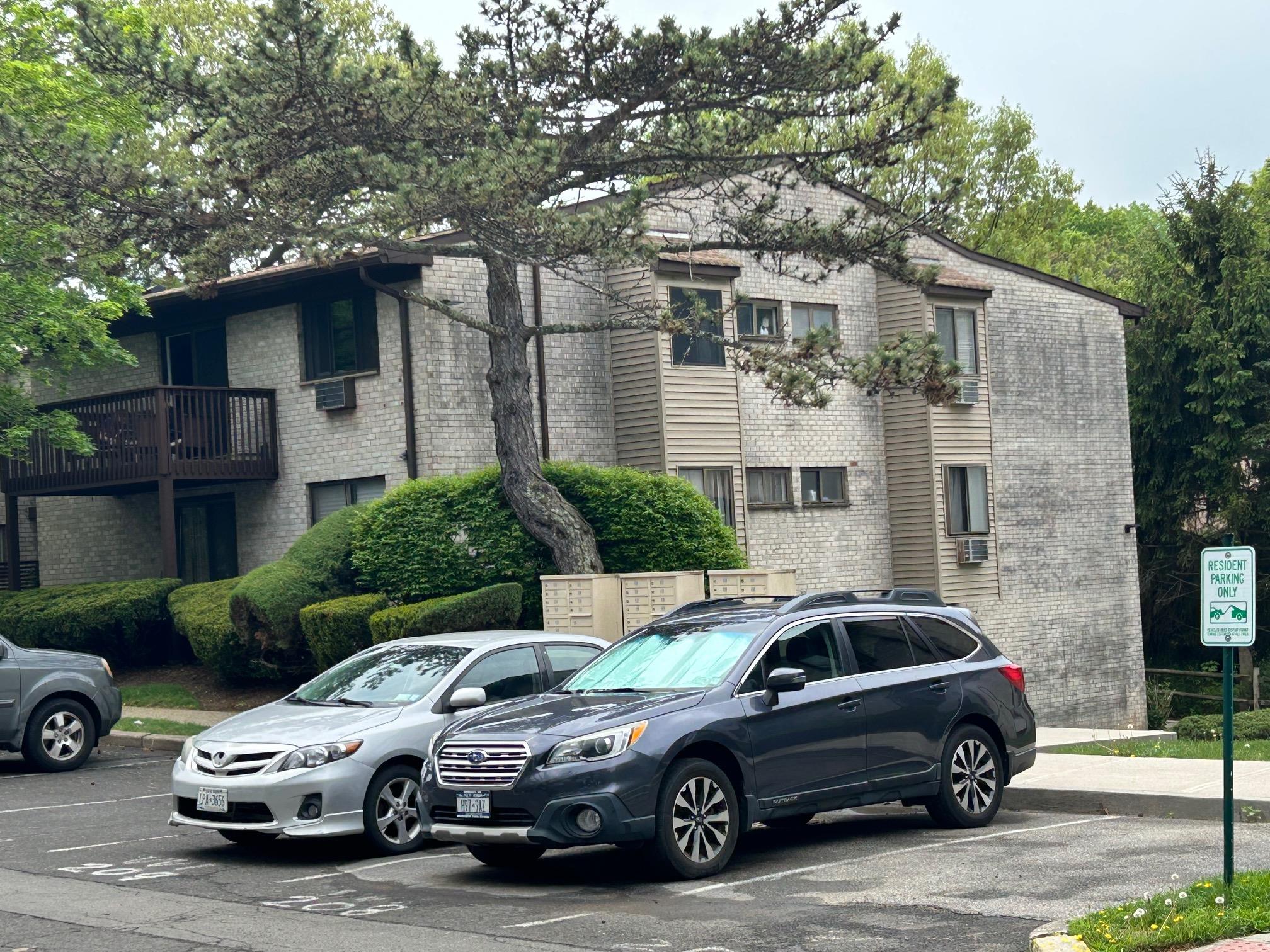 2 Secora Road, Unit C20 Monsey, NY 10952 - Photo 3 of 34 a car parked in front of a house