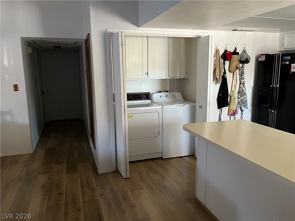 6412 West Pearcrest Road Las Vegas, NV 89108 - Photo 7 of 17 Functional laundry space featuring convenient bi-fold doors and overhead cabinetry.