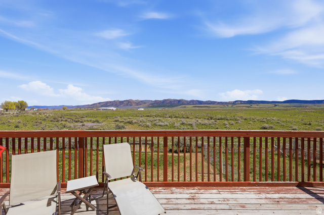 830 North Stone Road Snowville, UT 84336 - Photo 51 of 69 Wooden deck with a mountain view