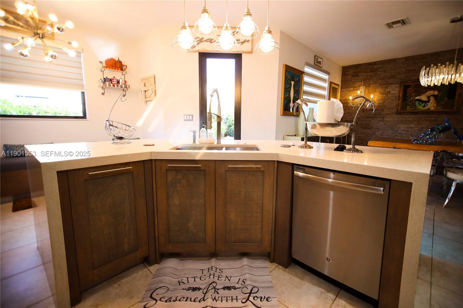11863 Southwest 233rd Terrace Homestead, FL 33032 - Photo 14 of 77 a kitchen with a sink a window and cabinets