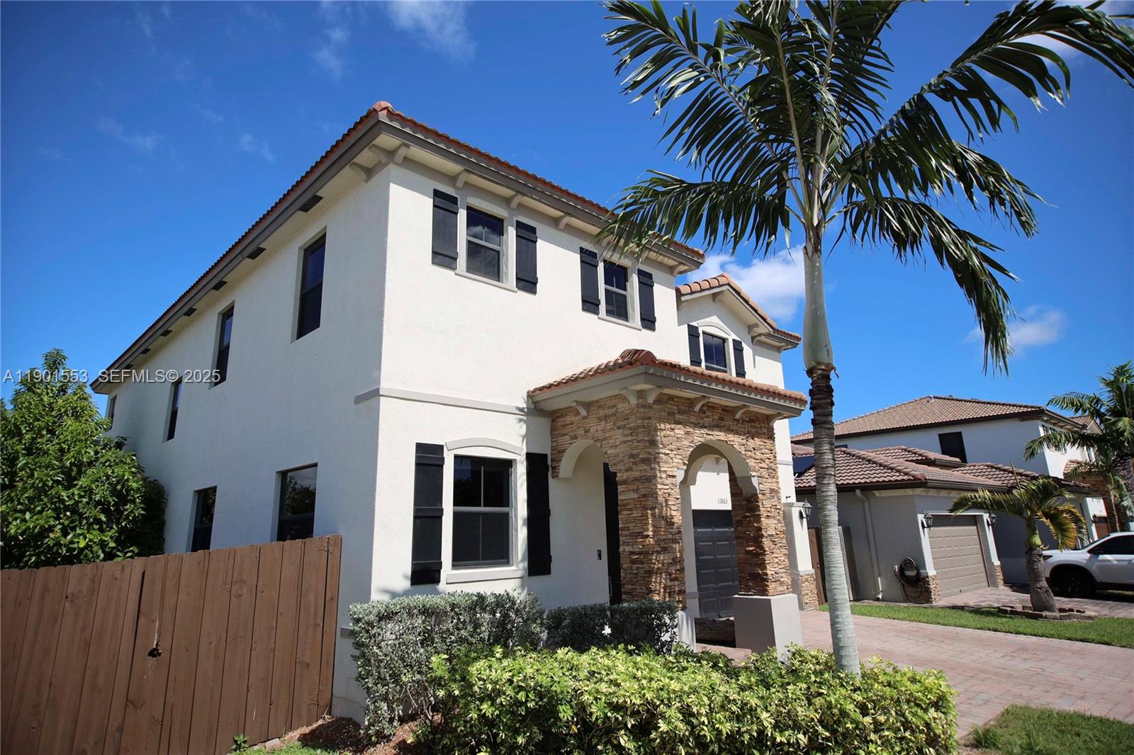11863 Southwest 233rd Terrace Homestead, FL 33032 - Photo 2 of 77 front view of a house with a yard