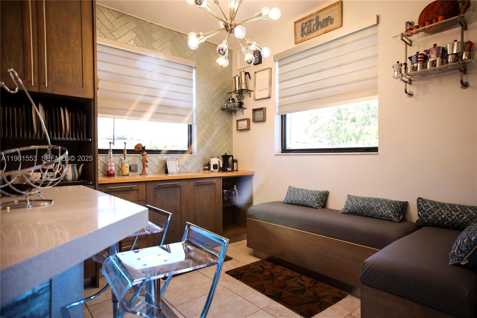 11863 Southwest 233rd Terrace Homestead, FL 33032 - Photo 23 of 77 a living room with furniture a window and a chandelier