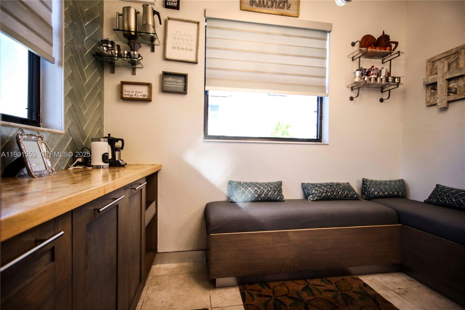 11863 Southwest 233rd Terrace Homestead, FL 33032 - Photo 24 of 77 a living room with furniture and a window