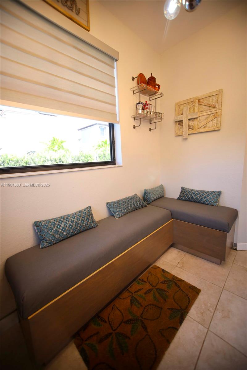 11863 Southwest 233rd Terrace Homestead, FL 33032 - Photo 27 of 77 a living room with furniture and a window