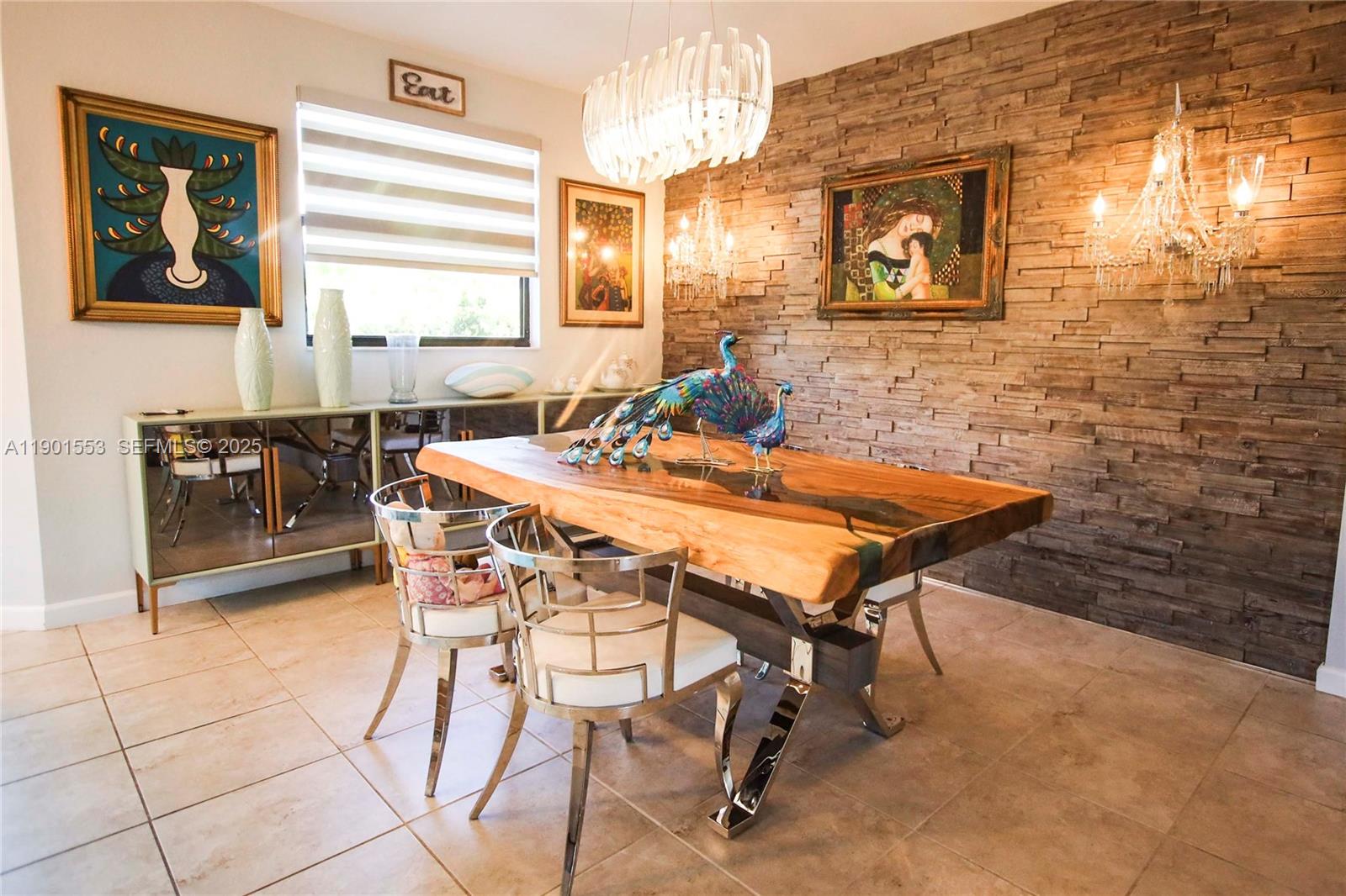 11863 Southwest 233rd Terrace Homestead, FL 33032 - Photo 31 of 77 a dining room with furniture and window