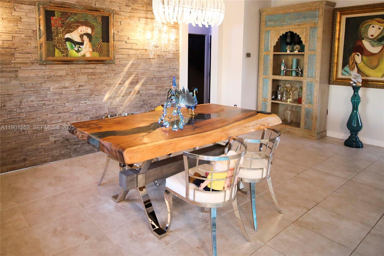 11863 Southwest 233rd Terrace Homestead, FL 33032 - Photo 33 of 77 a dining room with a table and chairs