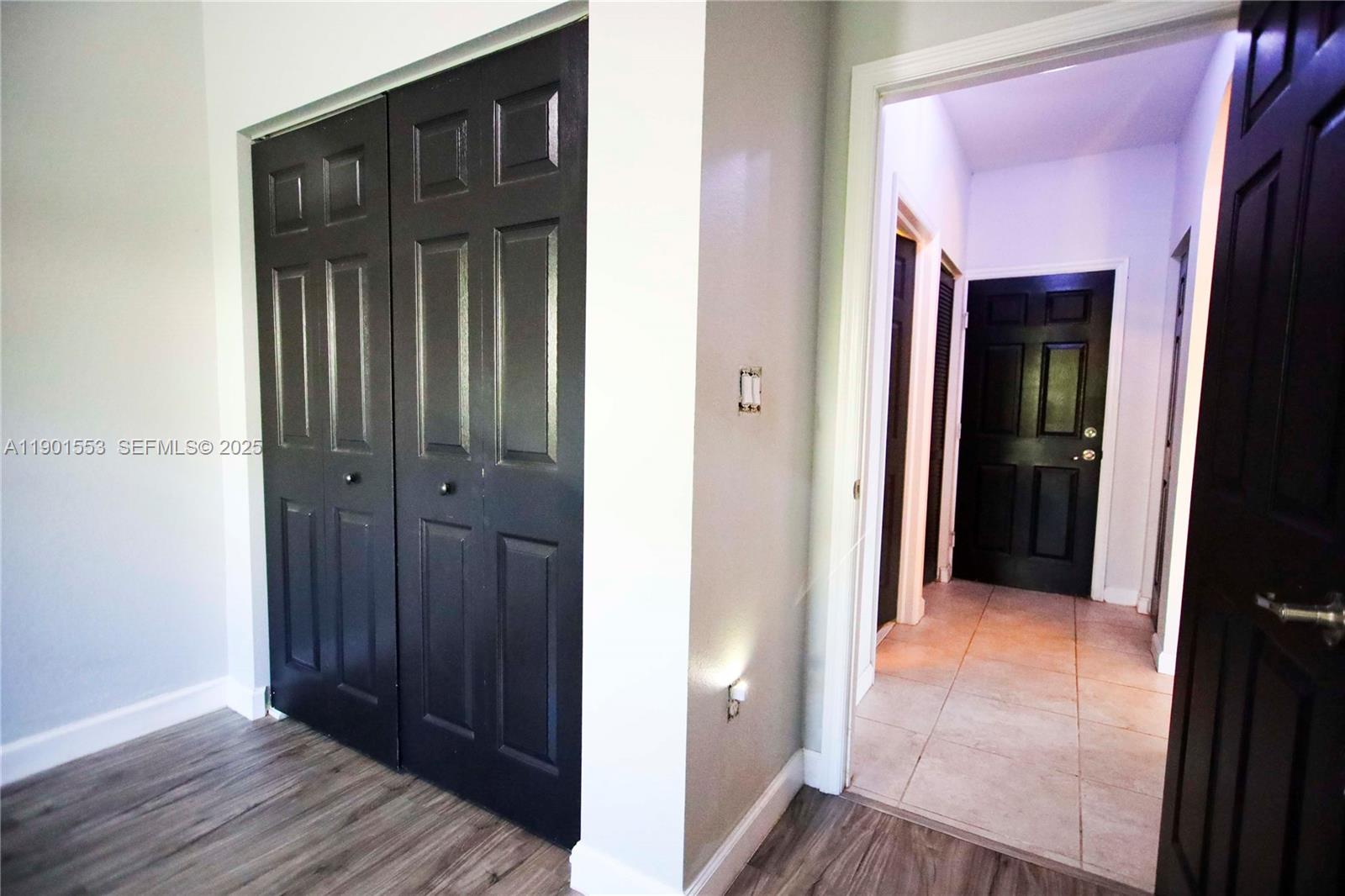 11863 Southwest 233rd Terrace Homestead, FL 33032 - Photo 37 of 77 a view of a hallway with wooden floor