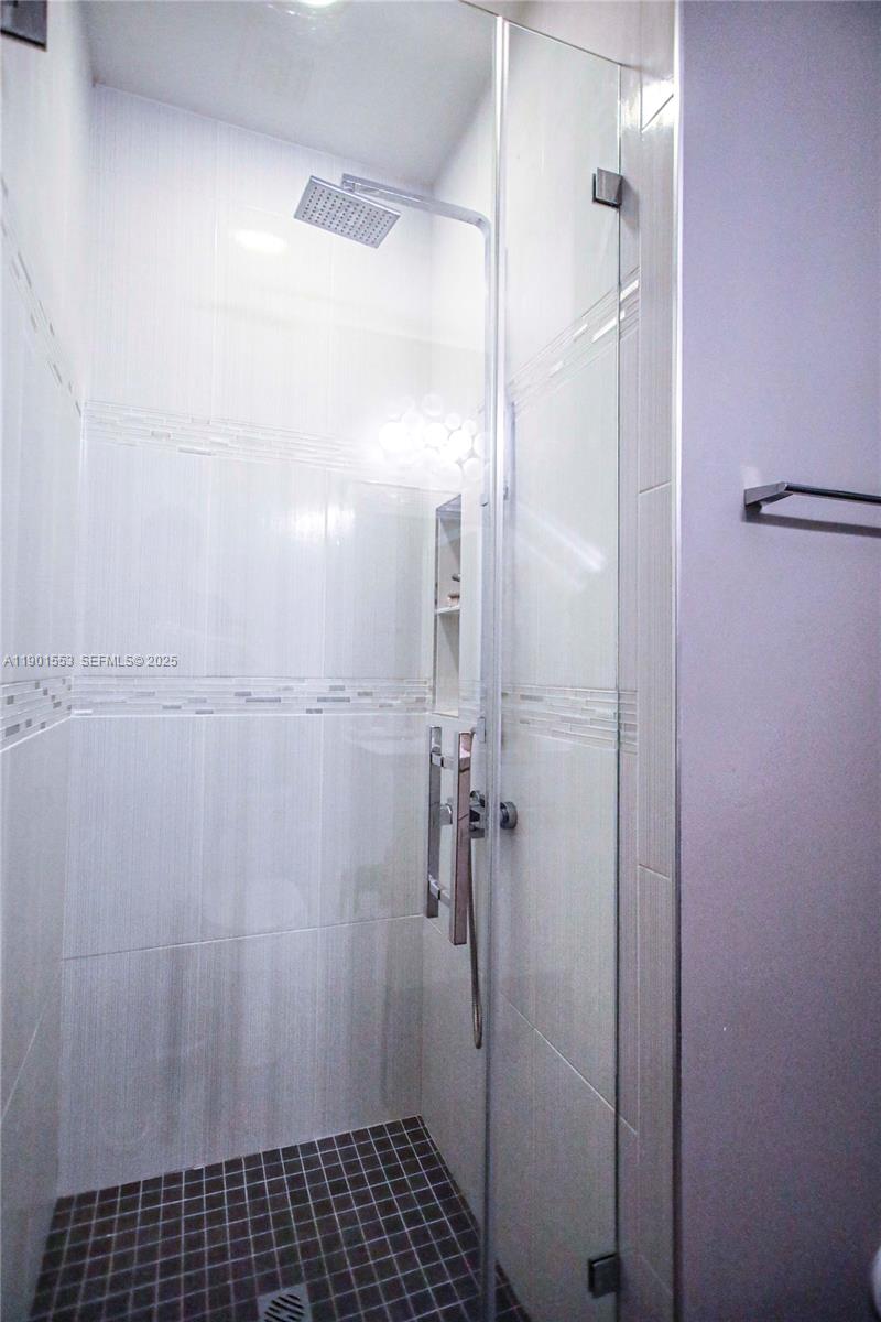 11863 Southwest 233rd Terrace Homestead, FL 33032 - Photo 40 of 77 a bathroom with a shower