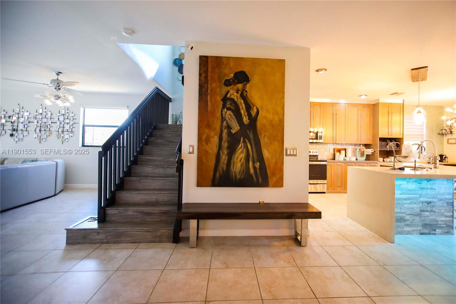 11863 Southwest 233rd Terrace Homestead, FL 33032 - Photo 43 of 77 a living room with furniture and a painting