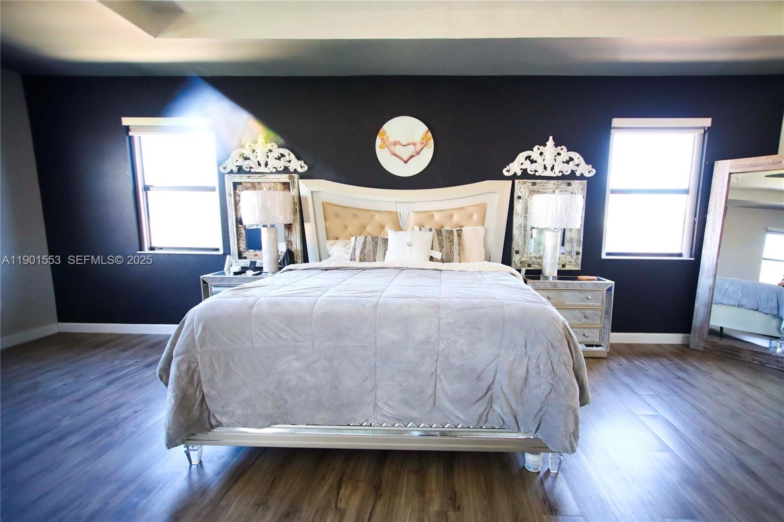 11863 Southwest 233rd Terrace Homestead, FL 33032 - Photo 48 of 77 a bed sitting in a bedroom next to a window