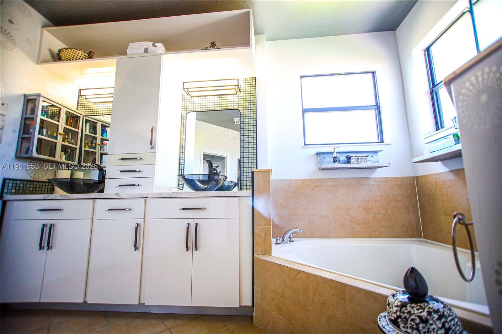 11863 Southwest 233rd Terrace Homestead, FL 33032 - Photo 51 of 77 a bathroom with a bathtub and a sink