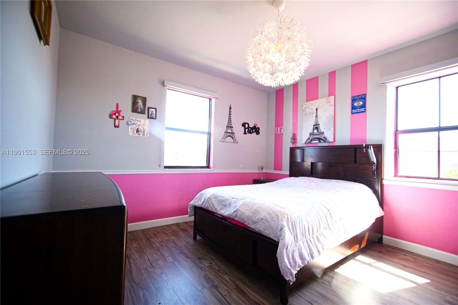 11863 Southwest 233rd Terrace Homestead, FL 33032 - Photo 61 of 77 a bedroom with a bed dresser and a window