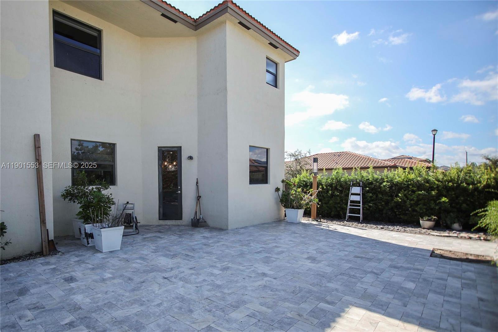 11863 Southwest 233rd Terrace Homestead, FL 33032 - Photo 74 of 77 a view of a house with porch and potted plants