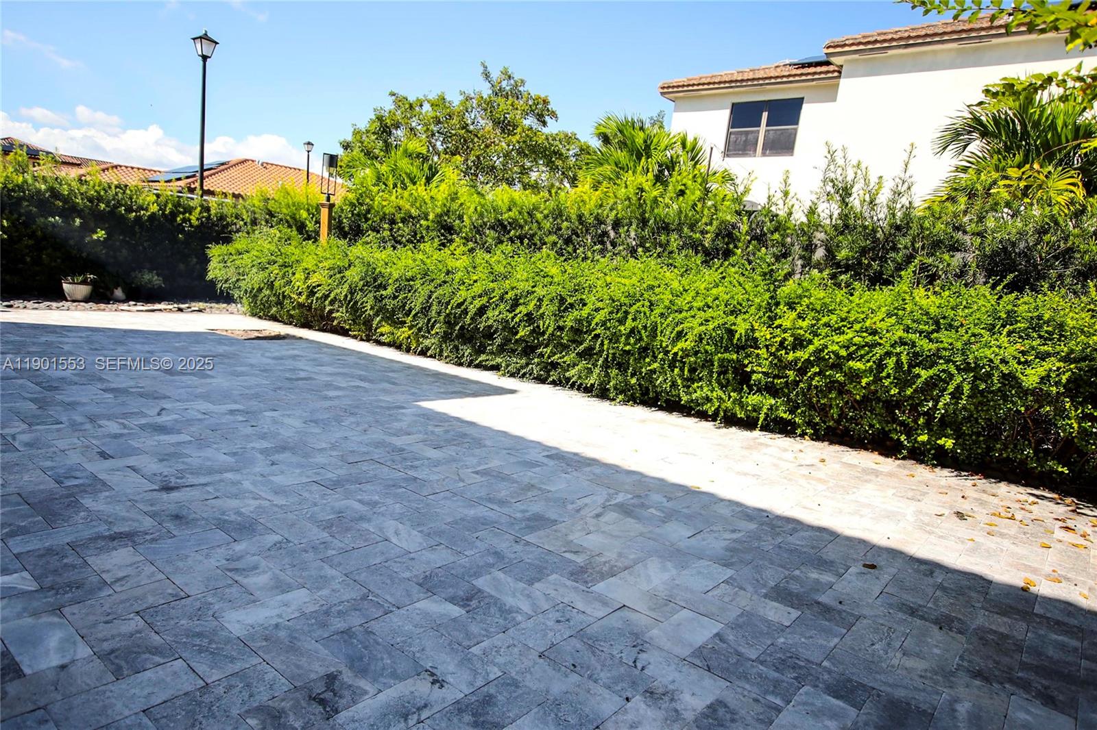 11863 Southwest 233rd Terrace Homestead, FL 33032 - Photo 76 of 77 a view of a garden with potted plants