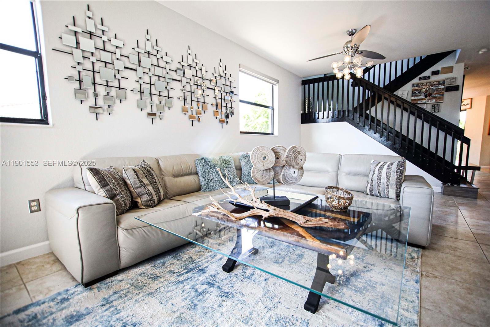 11863 Southwest 233rd Terrace Homestead, FL 33032 - Photo 8 of 77 a living room with furniture a wooden floor and a chandelier
