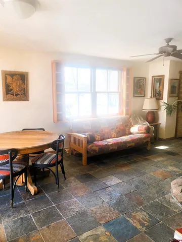 a kitchen with stainless steel appliances granite countertop a stove and a refrigerator
