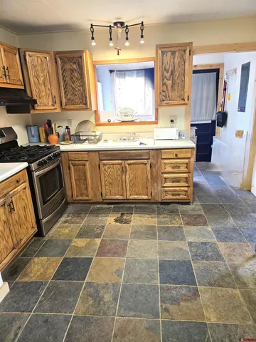 a bathroom with a glass door shower and a sink