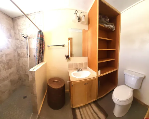 a view of hallway with wooden floor