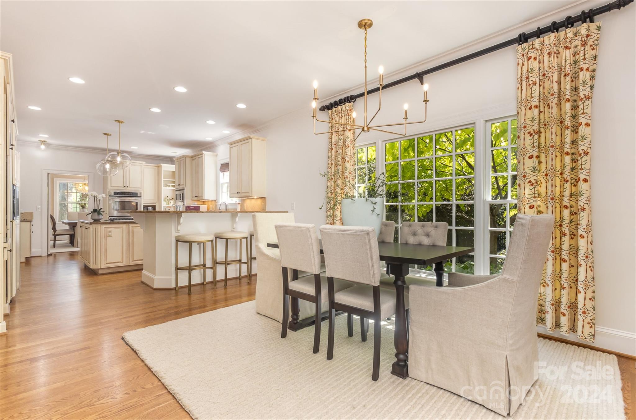 1900 South Wendover Road Charlotte, NC 28211 - Photo 14 of 38 a dining hall with stainless steel appliances kitchen island granite countertop a table and chairs