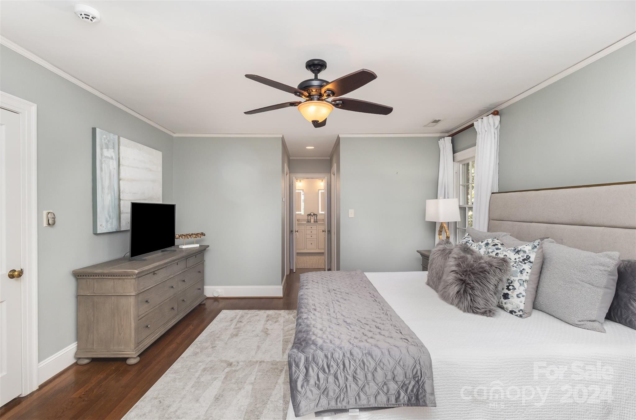 1900 South Wendover Road Charlotte, NC 28211 - Photo 19 of 38 a bedroom with a bed and a chandelier