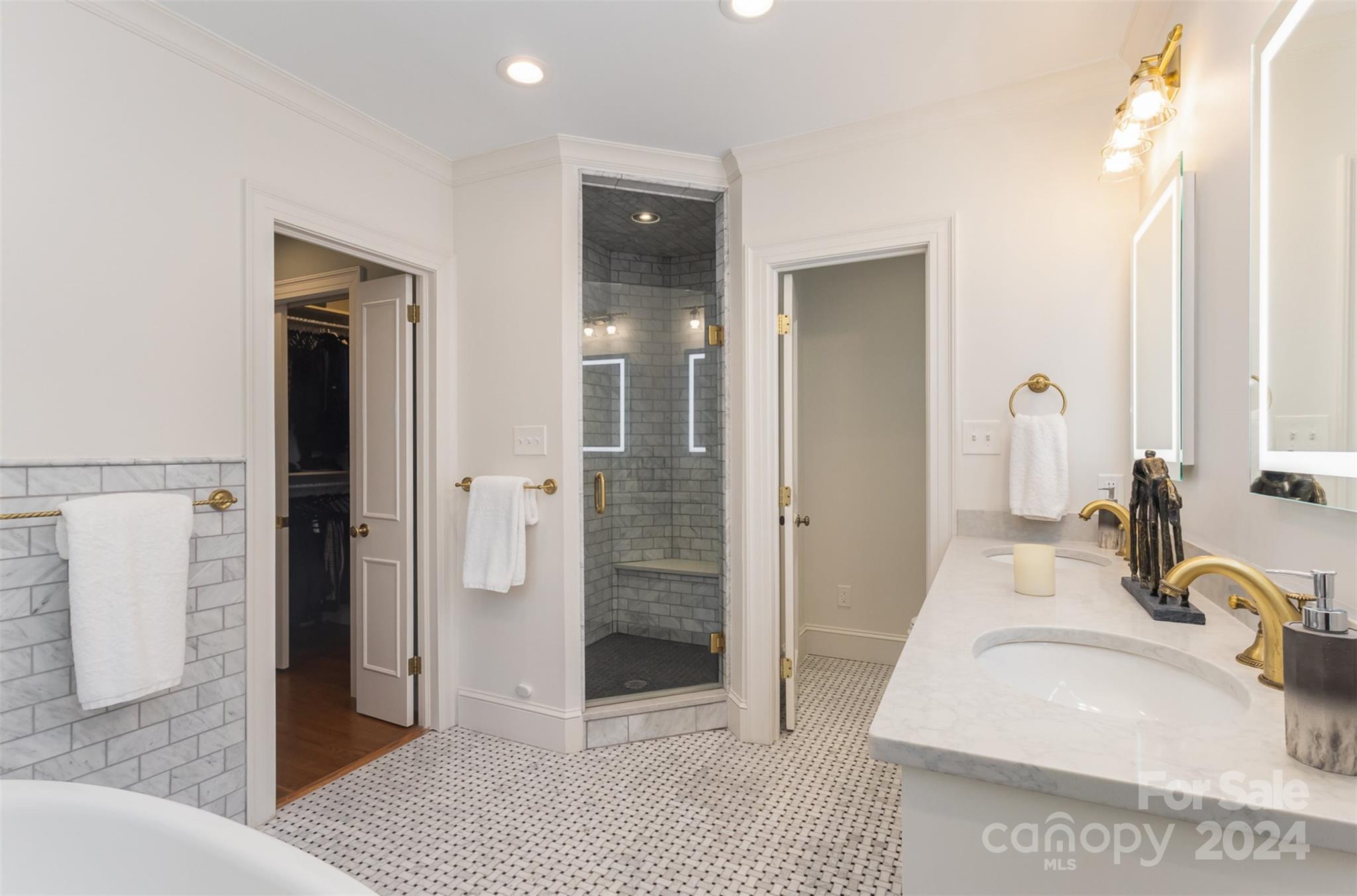 1900 South Wendover Road Charlotte, NC 28211 - Photo 21 of 38 a bathroom with a sink a toilet and shower