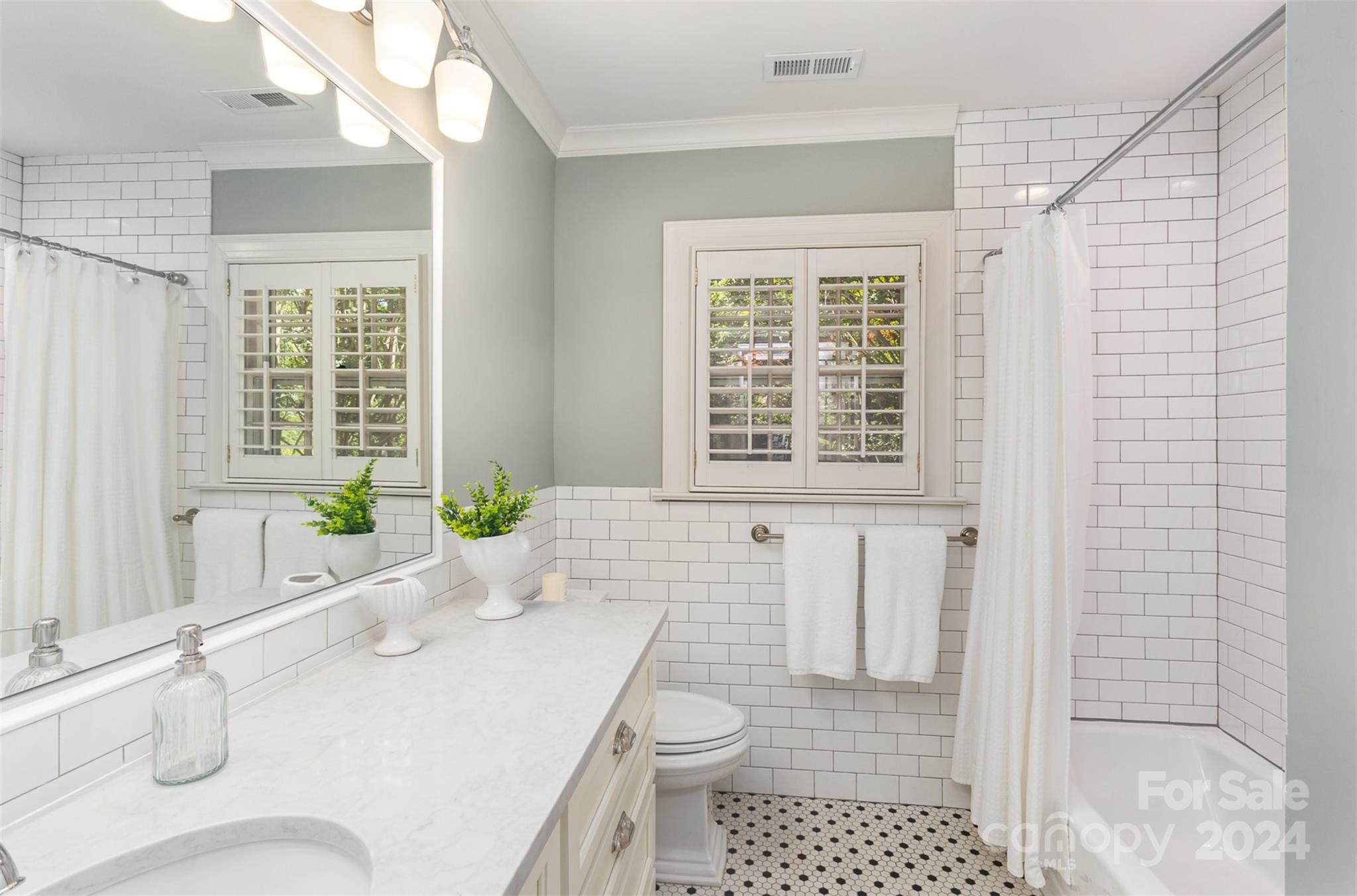 1900 South Wendover Road Charlotte, NC 28211 - Photo 24 of 38 a bathroom with a sink a toilet and shower