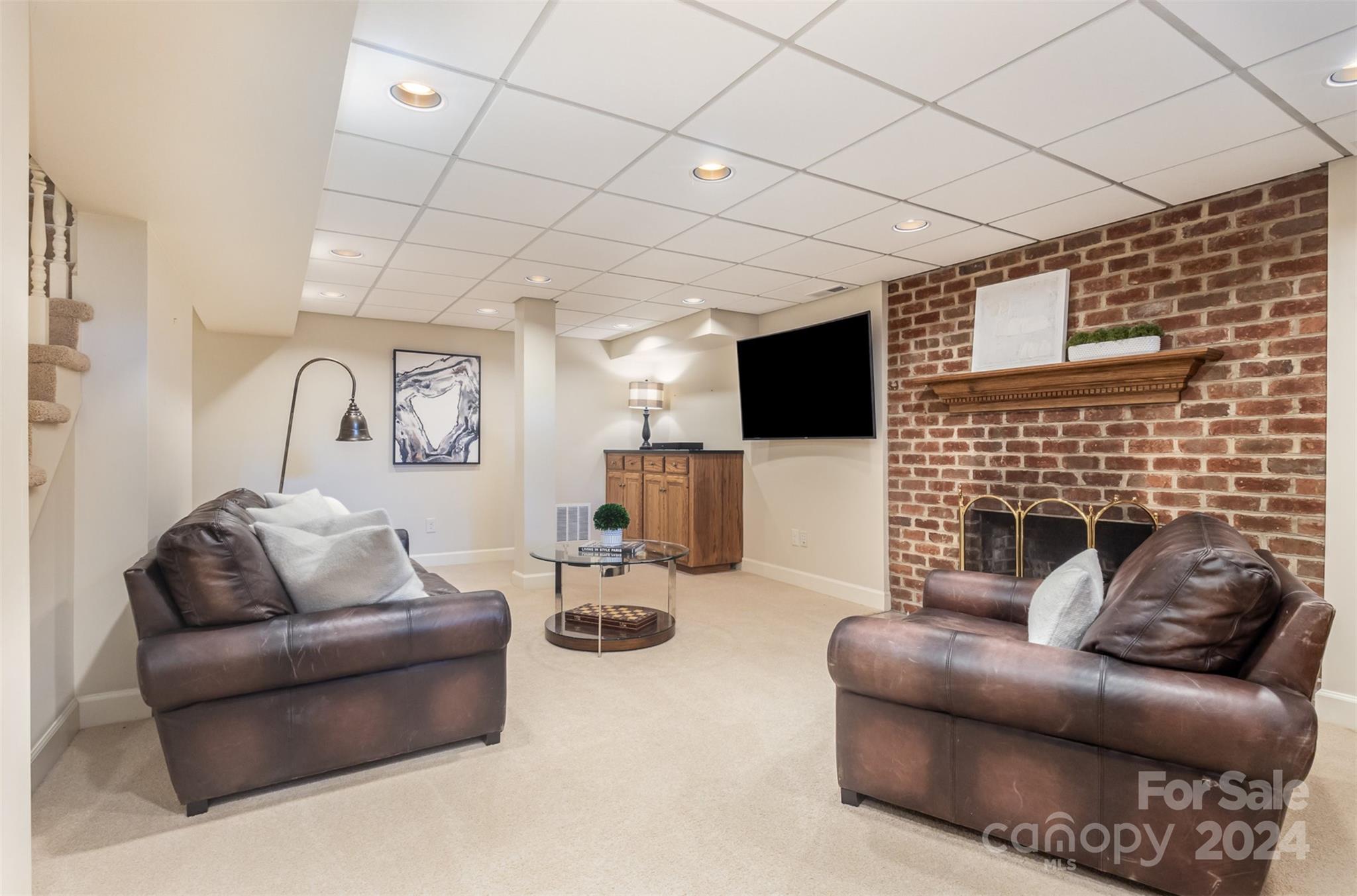 1900 South Wendover Road Charlotte, NC 28211 - Photo 25 of 38 a living room with furniture and a flat screen tv