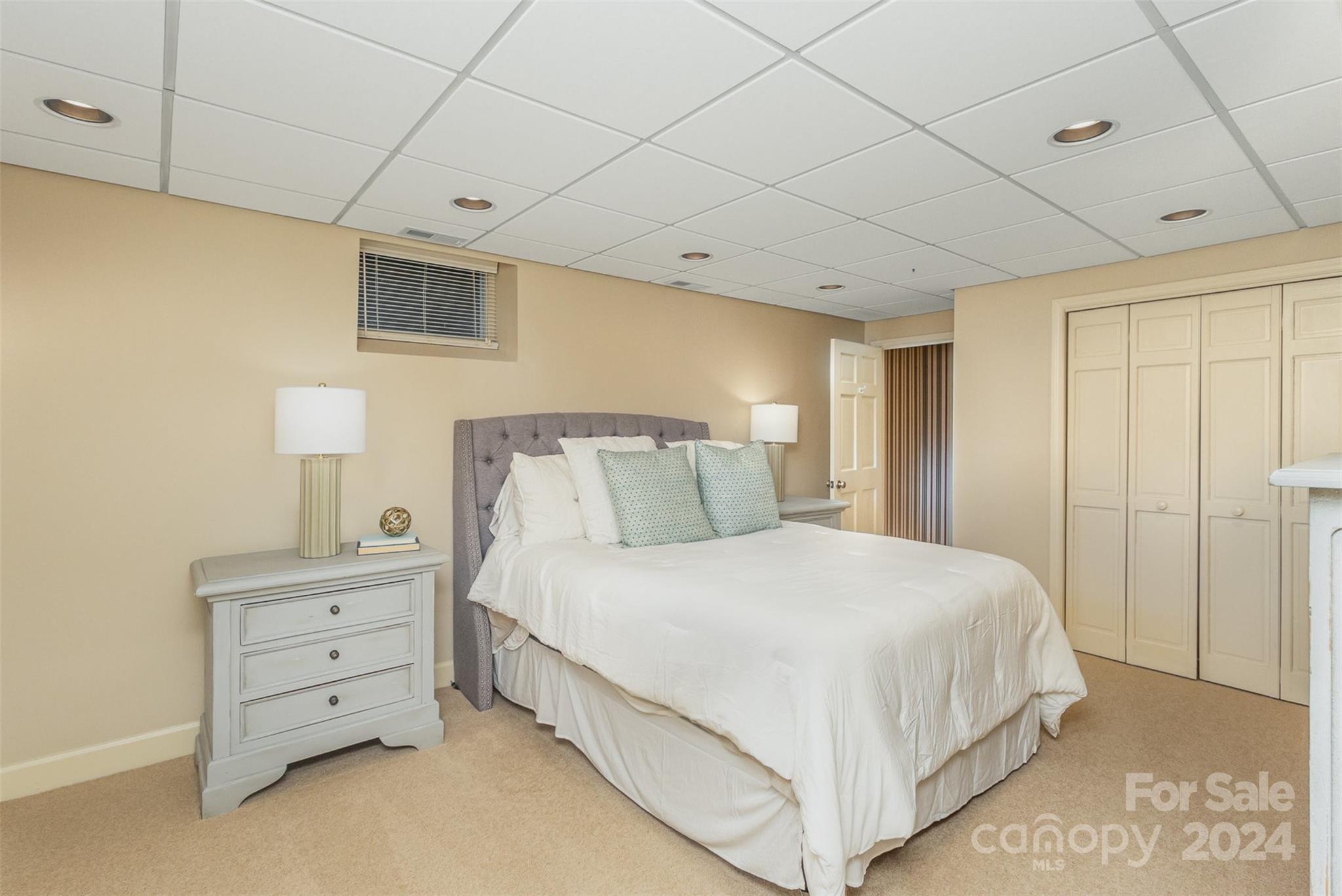 1900 South Wendover Road Charlotte, NC 28211 - Photo 26 of 38 a bedroom with a bed and a night stand