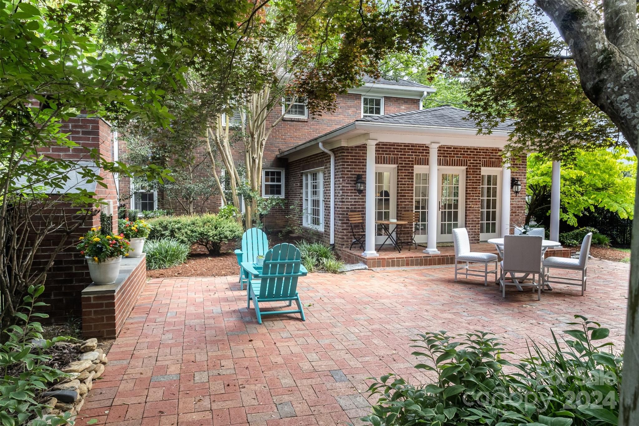 1900 South Wendover Road Charlotte, NC 28211 - Photo 28 of 38 a view of a house with backyard sitting area and garden